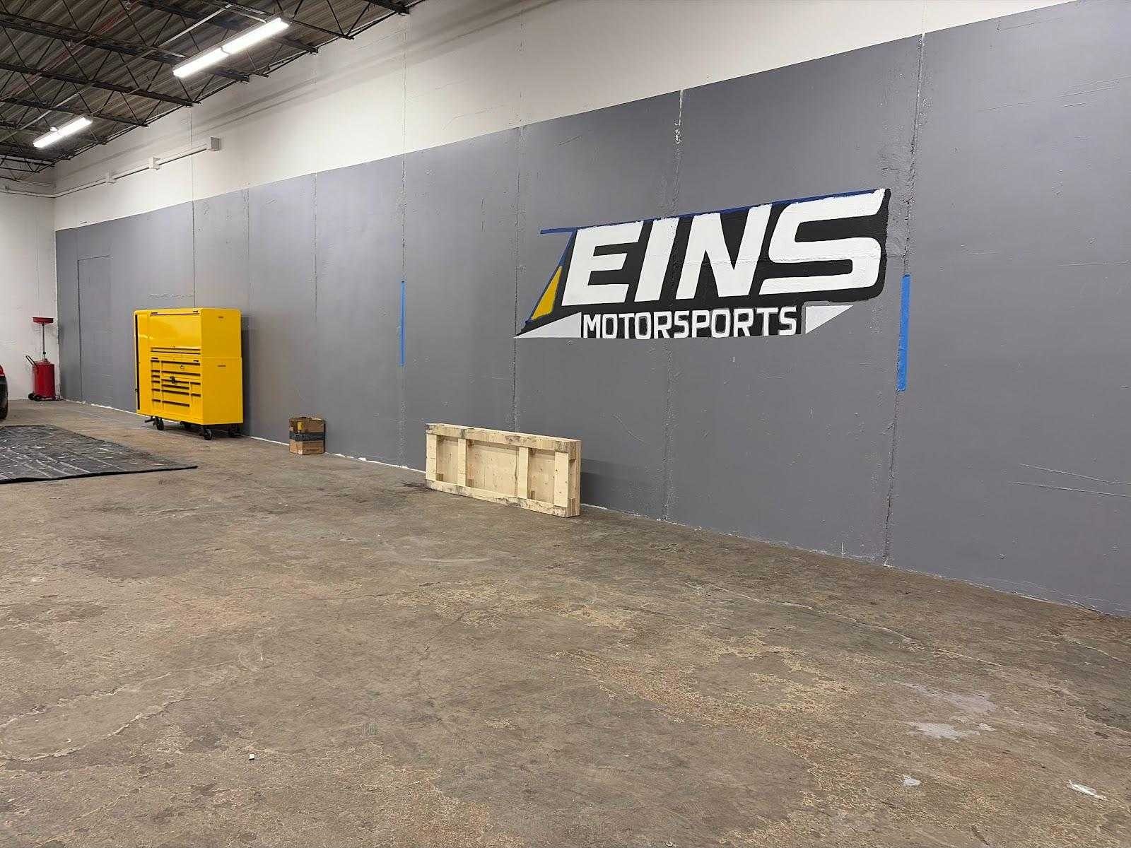 Day one: the logo going up on an empty wall