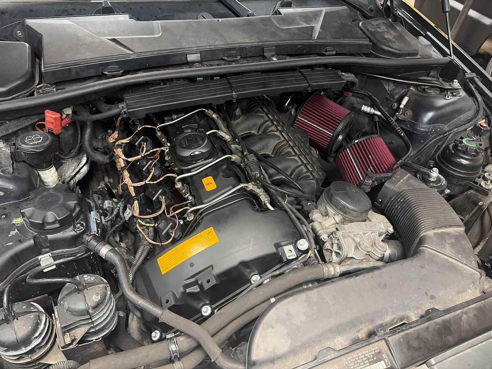 N54 engine bay with dual cone intakes
